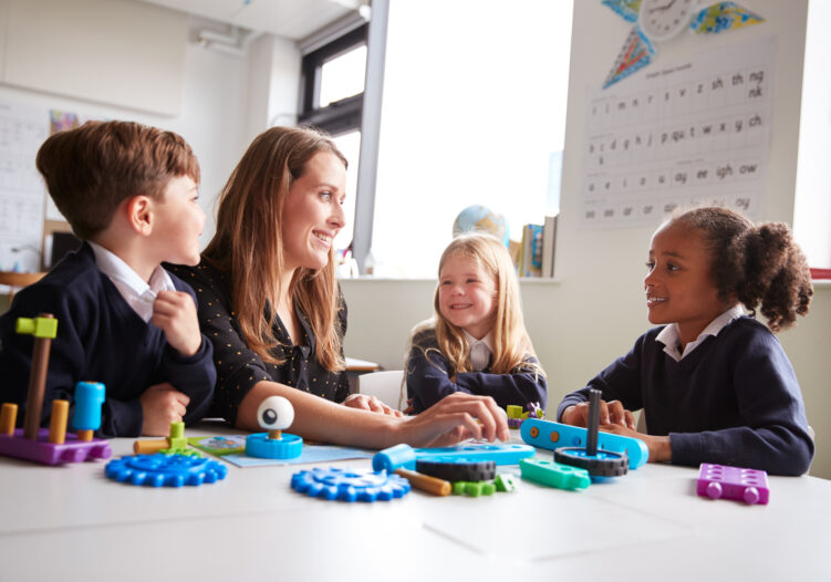 Teacher with young students in classroom